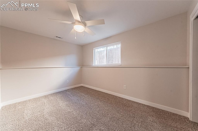 empty room with ceiling fan and carpet