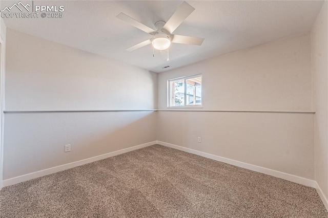 carpeted empty room featuring ceiling fan