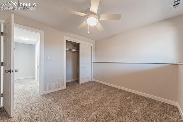 unfurnished bedroom featuring carpet flooring, ceiling fan, and a closet