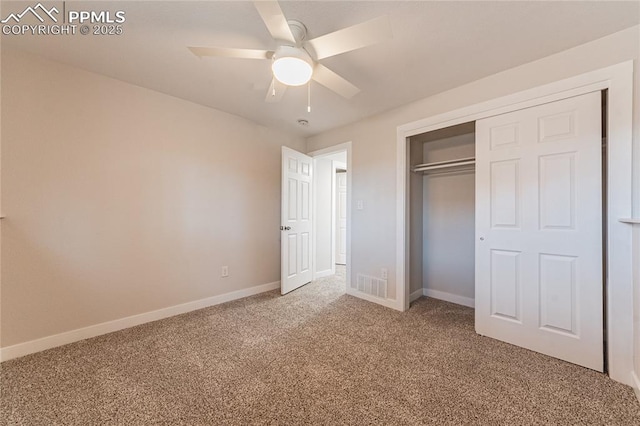 unfurnished bedroom with a closet, ceiling fan, and carpet