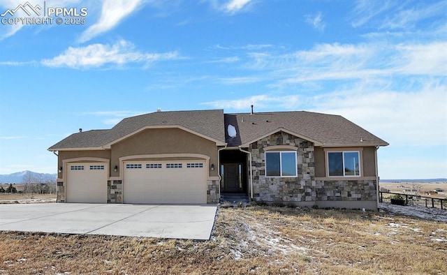 craftsman inspired home featuring a garage and a mountain view