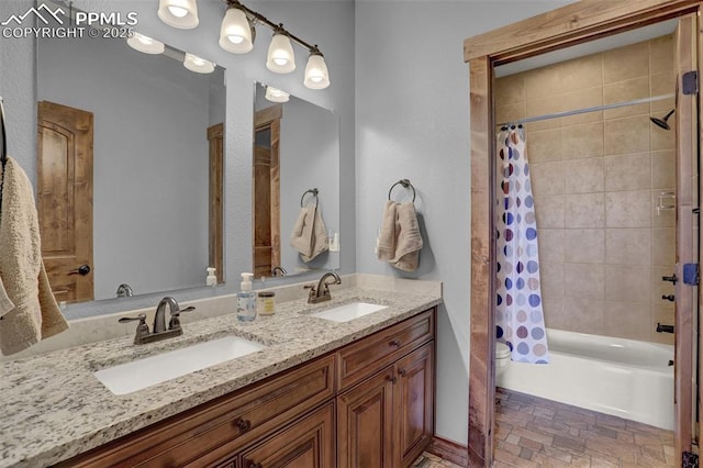 full bathroom featuring vanity, toilet, and shower / bath combo