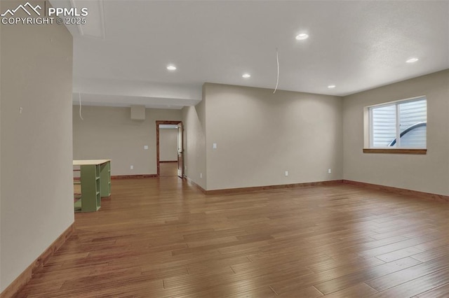 empty room with hardwood / wood-style floors