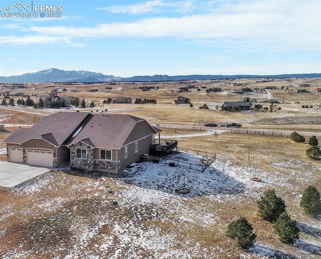 bird's eye view featuring a rural view and a mountain view