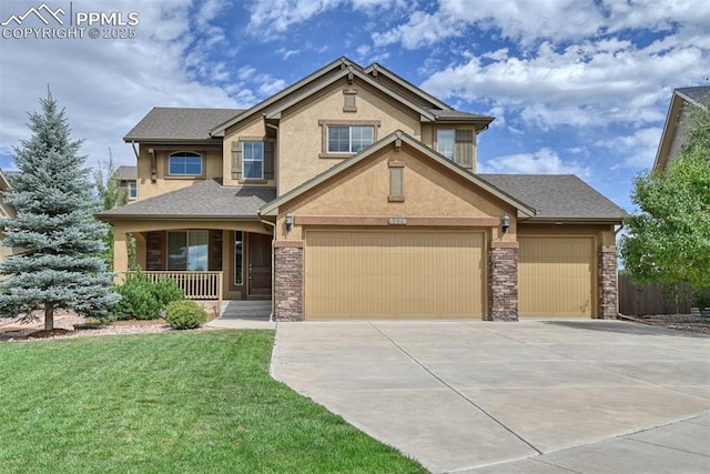 craftsman house featuring a garage, a front yard, and covered porch