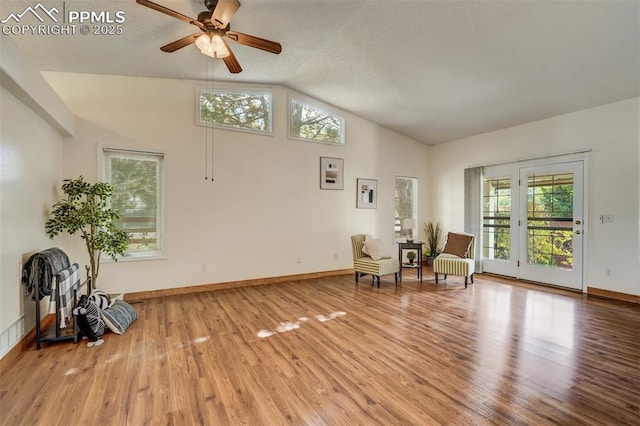 unfurnished room with hardwood / wood-style floors, vaulted ceiling, and ceiling fan