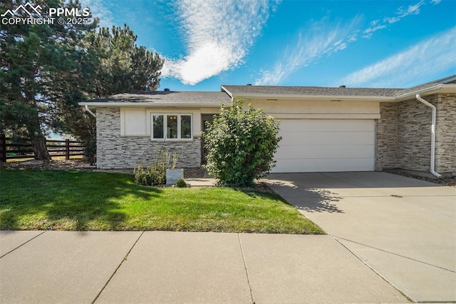 ranch-style home with a garage and a front yard