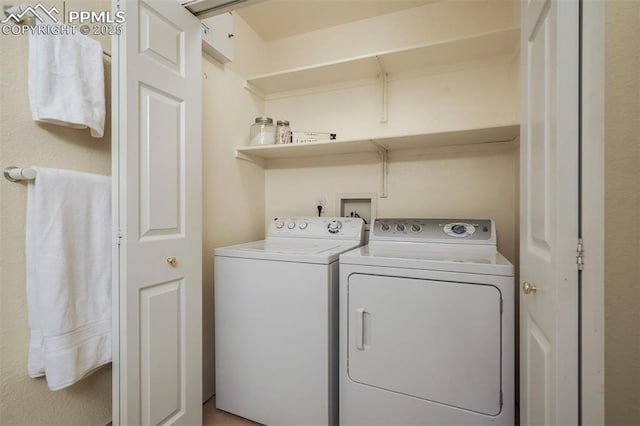 laundry area with independent washer and dryer