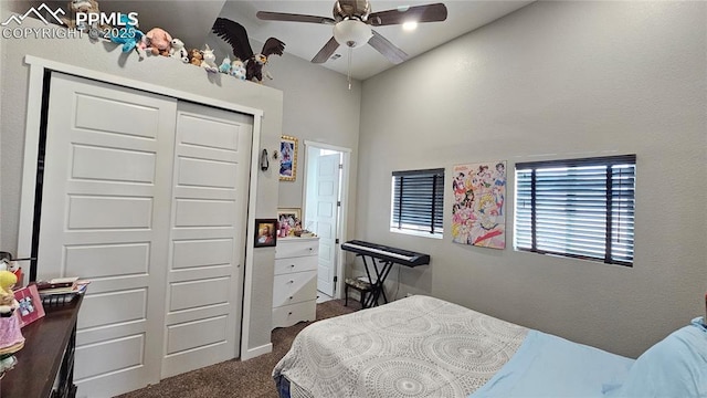 bedroom with a ceiling fan, dark carpet, and a closet