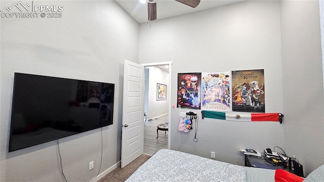 carpeted bedroom with a ceiling fan