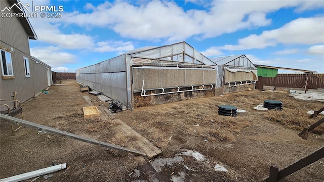 view of outdoor structure with a fenced backyard and an outdoor structure