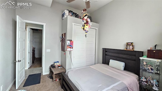 carpeted bedroom featuring ceiling fan, a closet, and baseboards