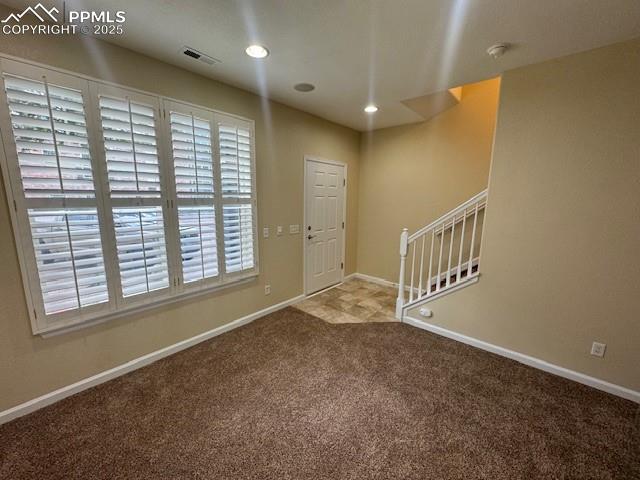 entryway featuring carpet floors