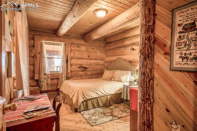 bedroom featuring wood ceiling, light hardwood / wood-style flooring, rustic walls, and beamed ceiling