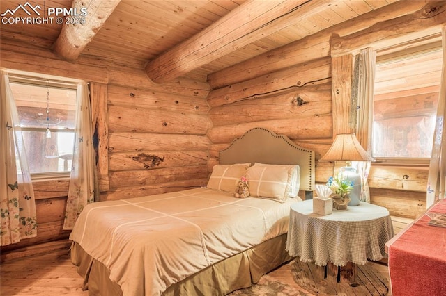 bedroom featuring beamed ceiling, wood ceiling, and hardwood / wood-style floors