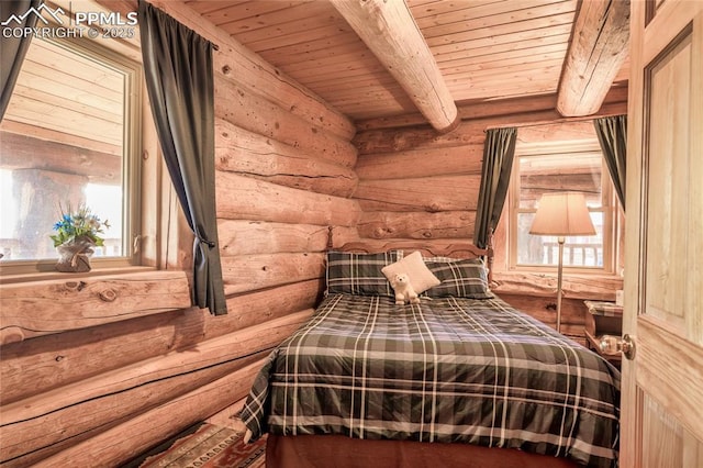 bedroom featuring beamed ceiling, wood ceiling, and log walls