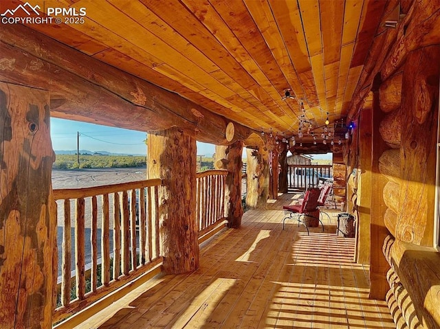 corridor featuring wood-type flooring, a water view, and wooden ceiling