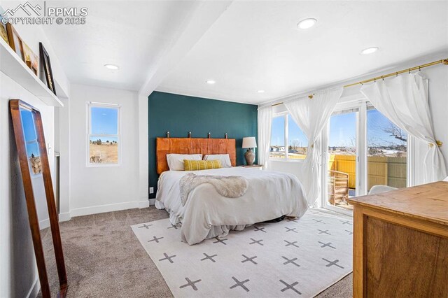 bedroom with multiple windows, light colored carpet, access to exterior, and beamed ceiling