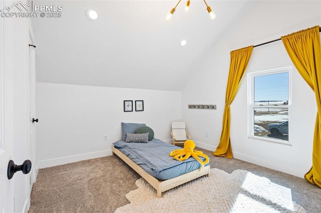 bedroom with vaulted ceiling and carpet