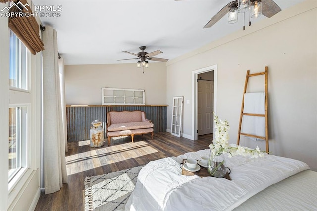 bedroom with dark hardwood / wood-style floors and ceiling fan