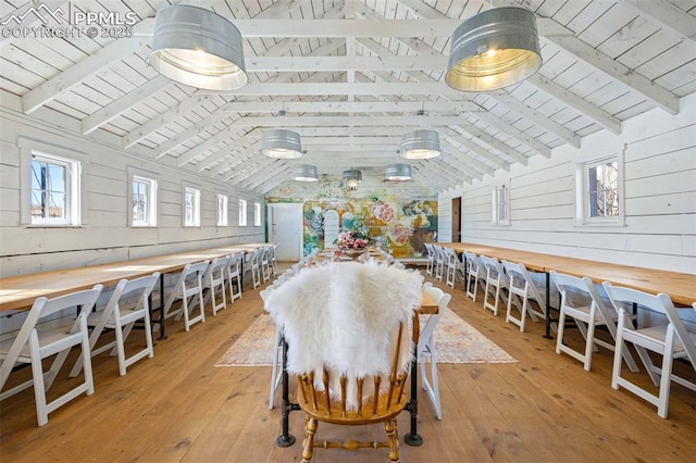 dining area with vaulted ceiling with beams, wood ceiling, and light wood-type flooring