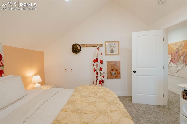 bedroom with light carpet and vaulted ceiling