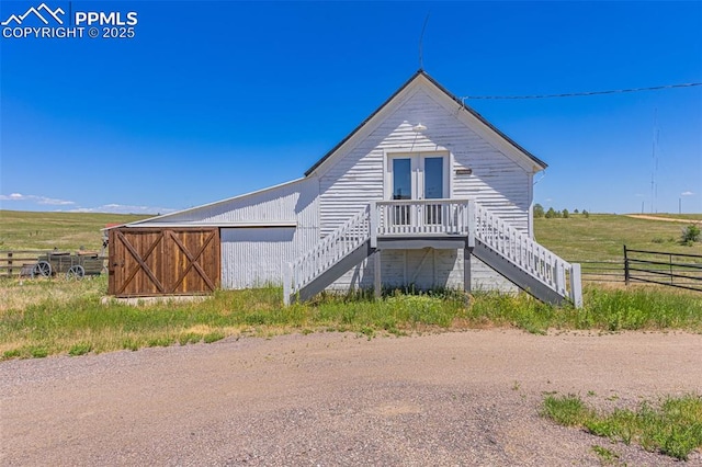 exterior space with a rural view