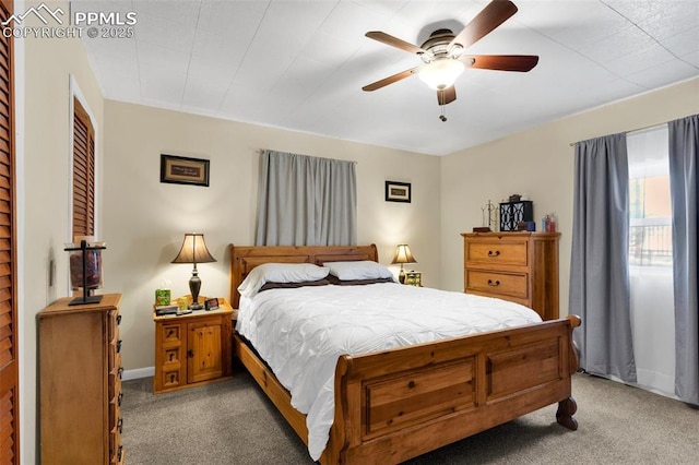 bedroom featuring ceiling fan and light carpet