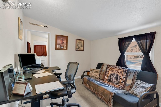 office area with vaulted ceiling, a textured ceiling, and carpet flooring