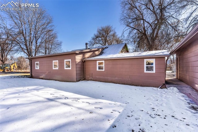 view of snow covered house