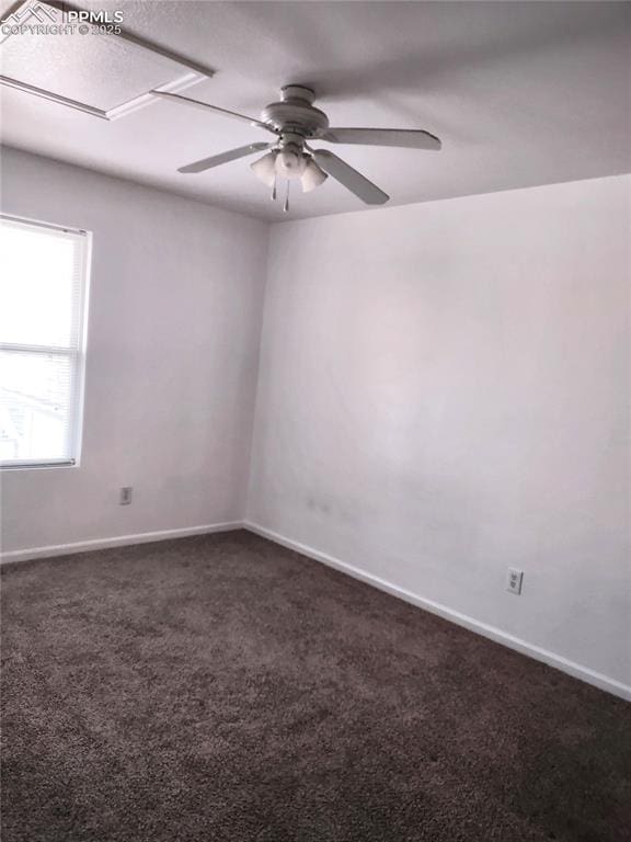 carpeted empty room featuring ceiling fan