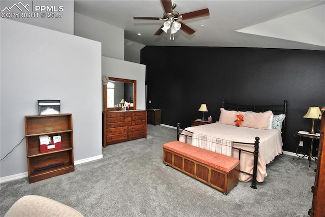 carpeted bedroom featuring ceiling fan and vaulted ceiling