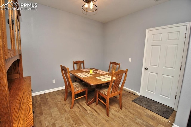 dining area featuring light wood-type flooring