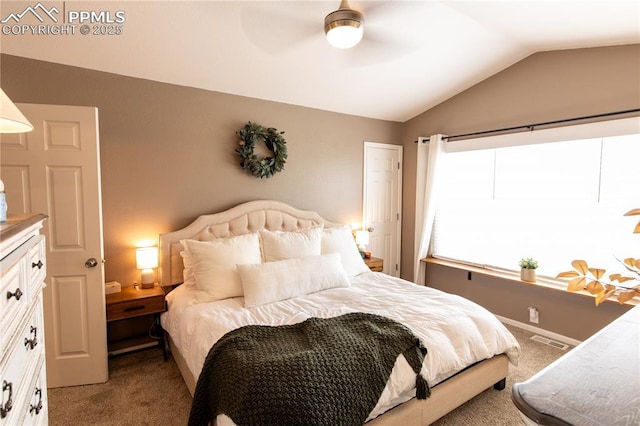 carpeted bedroom featuring vaulted ceiling and ceiling fan