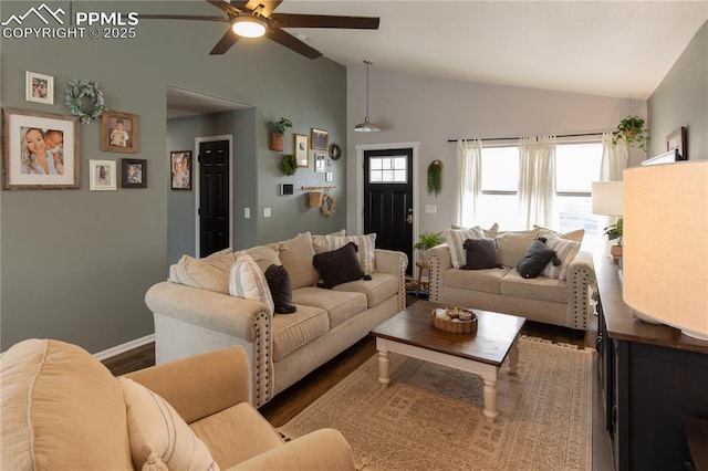 living room with hardwood / wood-style flooring, vaulted ceiling, and ceiling fan