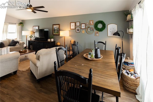 dining room with vaulted ceiling, dark hardwood / wood-style floors, and ceiling fan