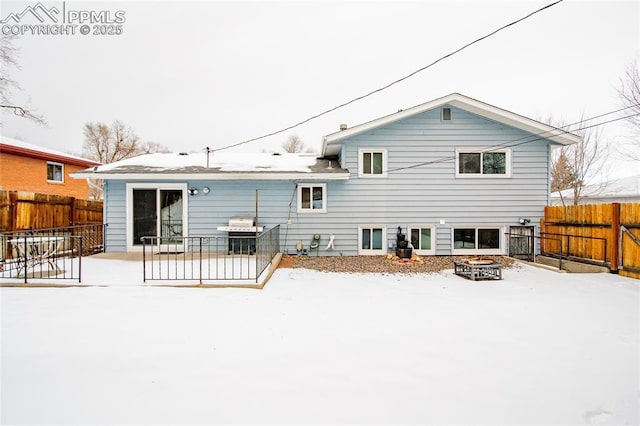 517 W Ramona Ave, Colorado Springs, CO 80905 - snow covered back of property featuring a fire pit