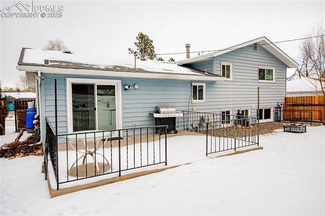 517 W Ramona Ave, Colorado Springs, CO 80905 - snow covered back of property with a fire pit