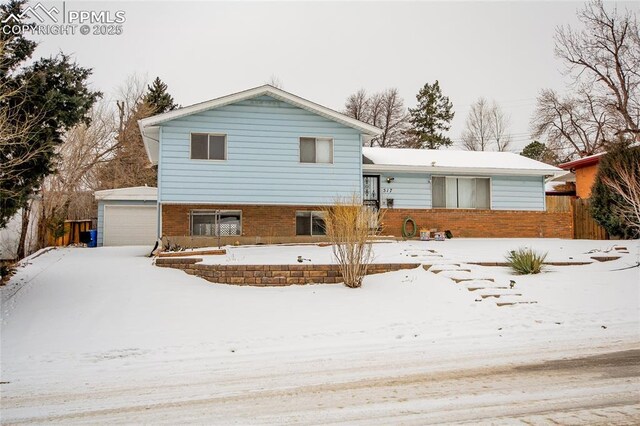 517 W Ramona Ave, Colorado Springs, CO 80905 - tri-level home featuring a garage