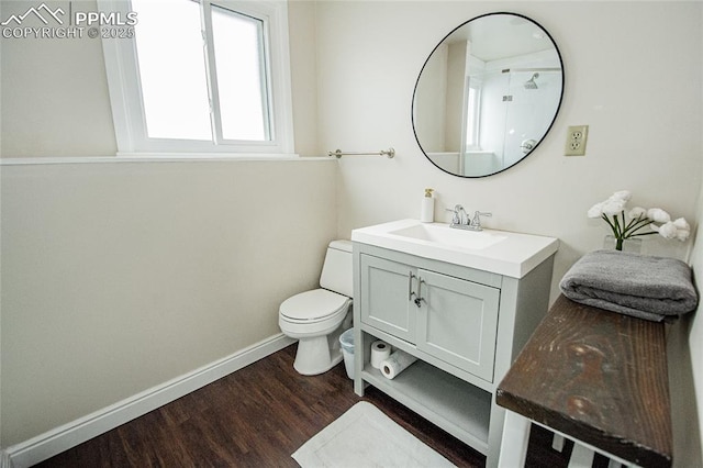 517 W Ramona Ave, Colorado Springs, CO 80905 - bathroom with vanity, hardwood / wood-style flooring, and toilet