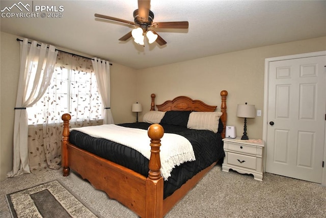 bedroom with light colored carpet and ceiling fan