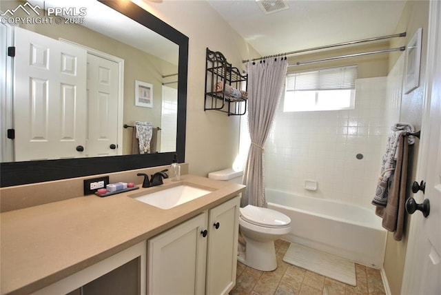 full bathroom featuring shower / bathtub combination with curtain, vanity, and toilet