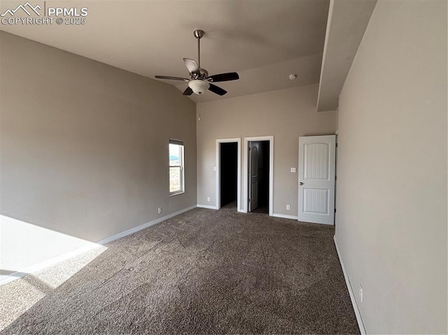 unfurnished bedroom featuring dark carpet and ceiling fan