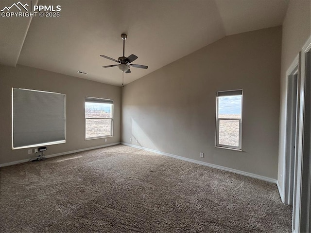 spare room featuring ceiling fan, lofted ceiling, carpet, and a wealth of natural light