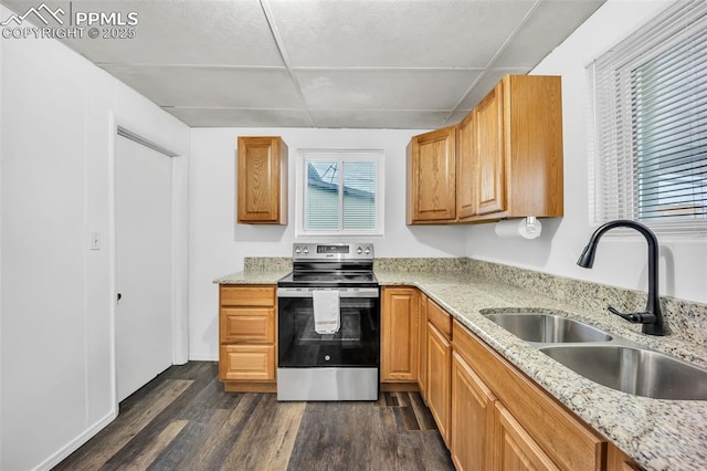 kitchen with dark wood-type flooring, light stone countertops, sink, and electric range