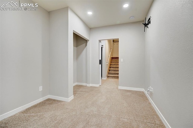 hallway with light carpet