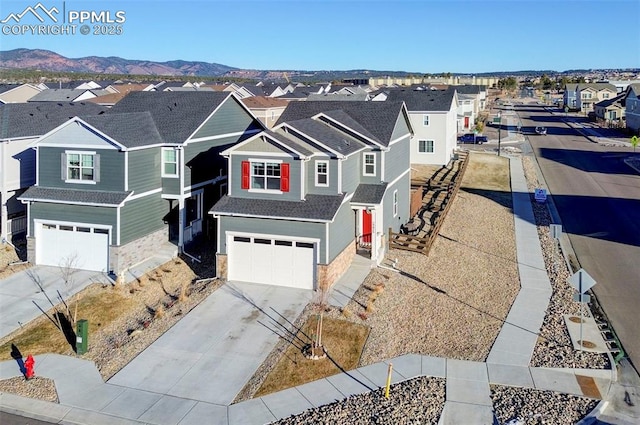 view of front of house with a garage and a mountain view