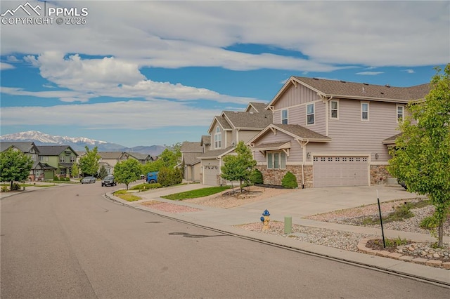 view of front of home featuring a mountain view and a garage