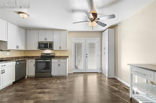 kitchen with white cabinetry, sink, stainless steel appliances, dark wood-type flooring, and french doors