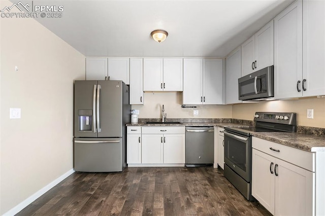 kitchen featuring white cabinets and appliances with stainless steel finishes